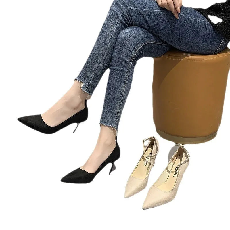 Women's black stiletto heel pump shoes with buckle detail and skull pattern lining
