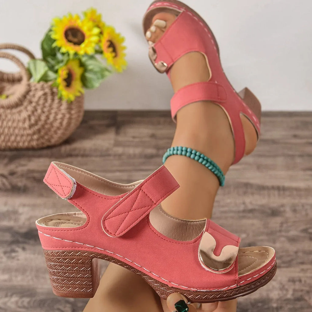 Women's light brown Velcro Roman sandals with a round toe and adjustable strap on a rubber sole.