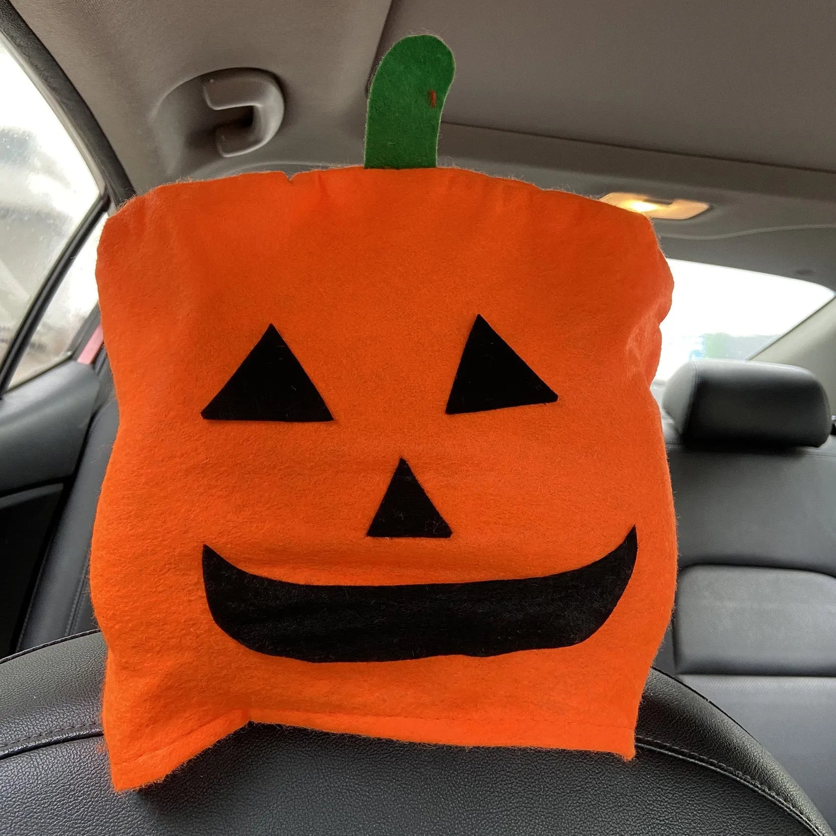 Orange pumpkin cartoon polyester Halloween decorative car chair cover on a car seat