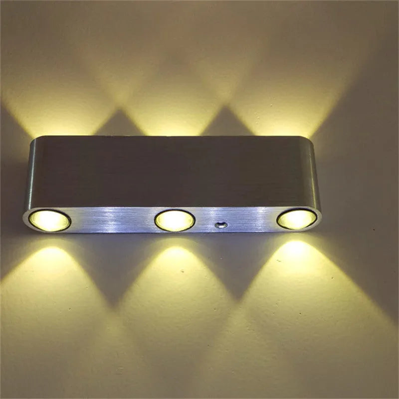 Silver aluminium rectangular wall lamp with LED lighting showing multiple colour options