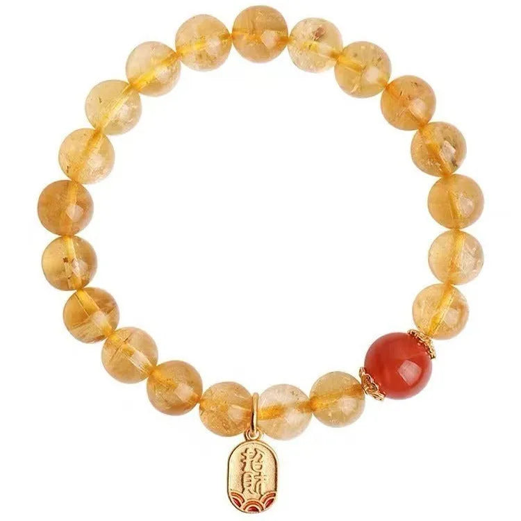 Natural red agate bead bracelet with gold ruby accents on a wrist, showing three bead size options.
