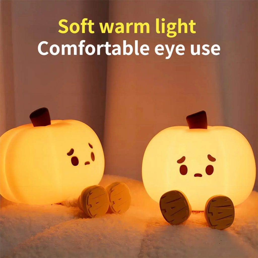 Soft orange silicone pumpkin-shaped night light with a warm glowing light.