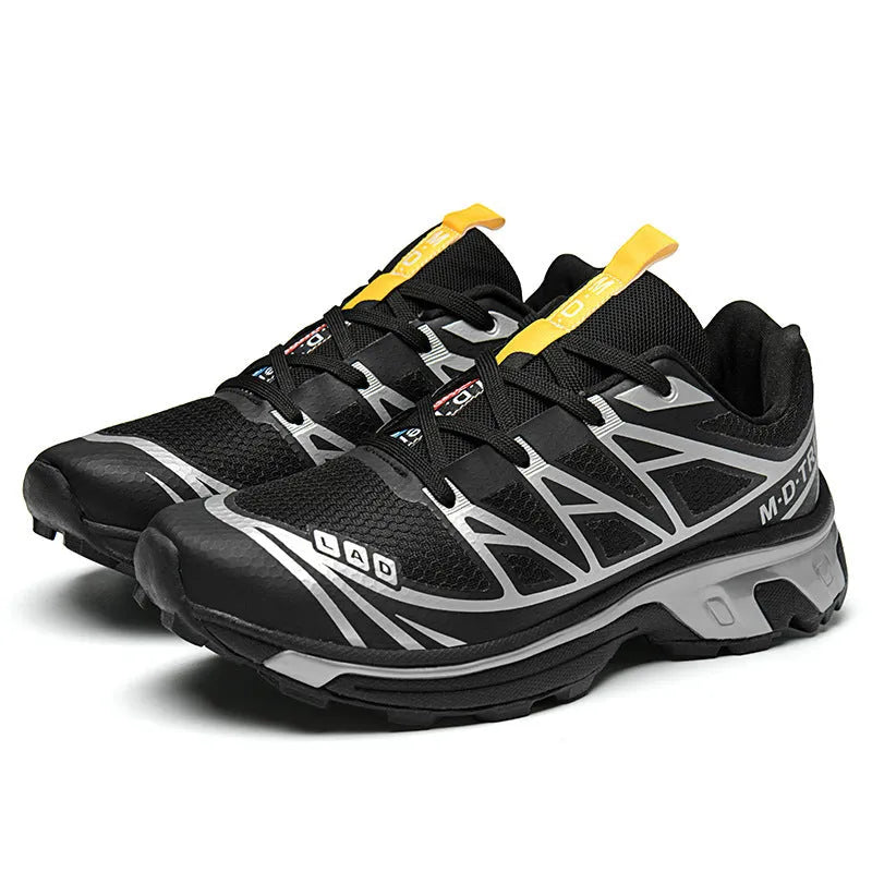 Low-top hiking shoes in artificial leather with mesh lining and rubber sole.