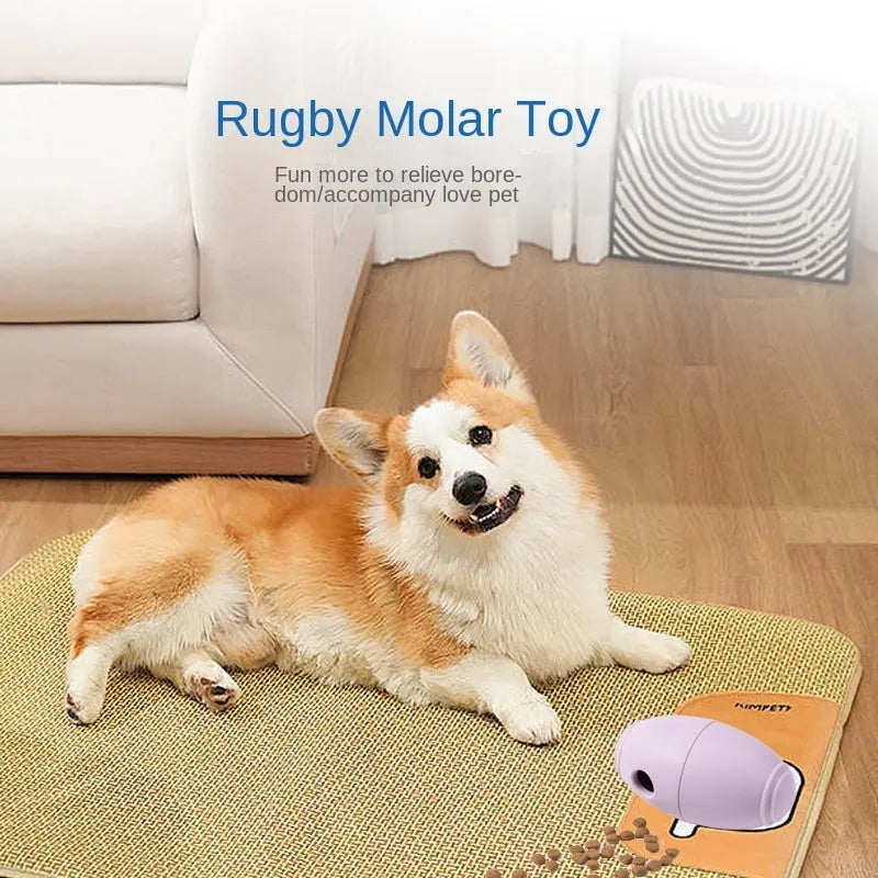 Blue silicone rugby ball dog toy with hollow treat compartment on a wooden floor