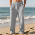 Men's baggy straight trousers in solid colour with drawstring waist, polyester blend fabric, casual style