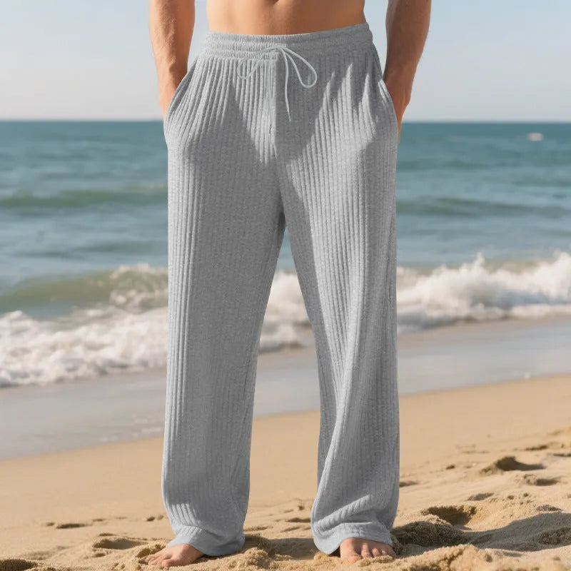 Men's baggy straight trousers in solid colour with drawstring waist, polyester blend fabric, casual style