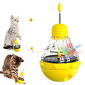 Interactive cat wand toy with slow feeder, showing bouncing ball on elastic stick and colourful rugby barbell design on yellow base.