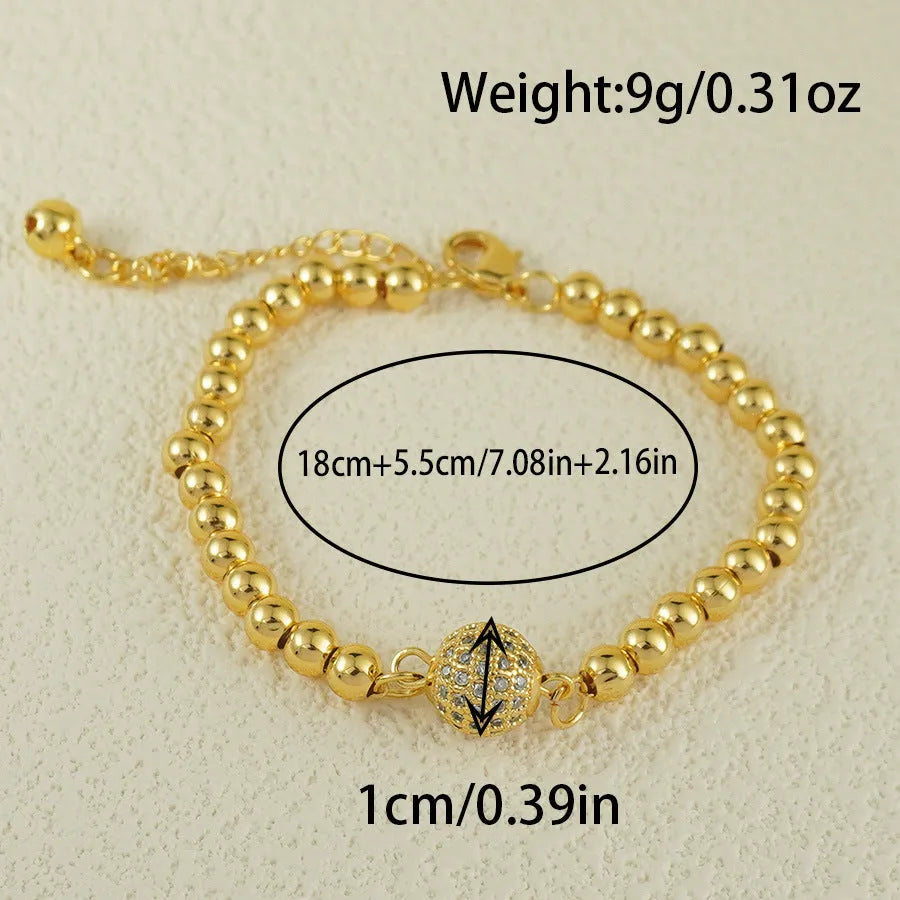 Close-up of a women's copper heart bracelet with a round zircon stone in an Arabic style.
