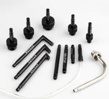 A 13-piece automatic transmission oil refuelling kit with a manual pump, hoses, and connectors laid out.