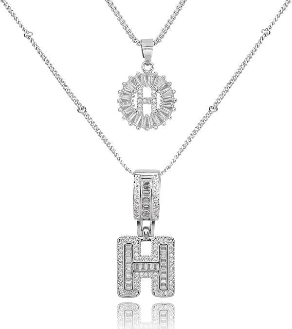 26 English letters copper-plated gold diamond initial pendant necklace with adjustable chain on display