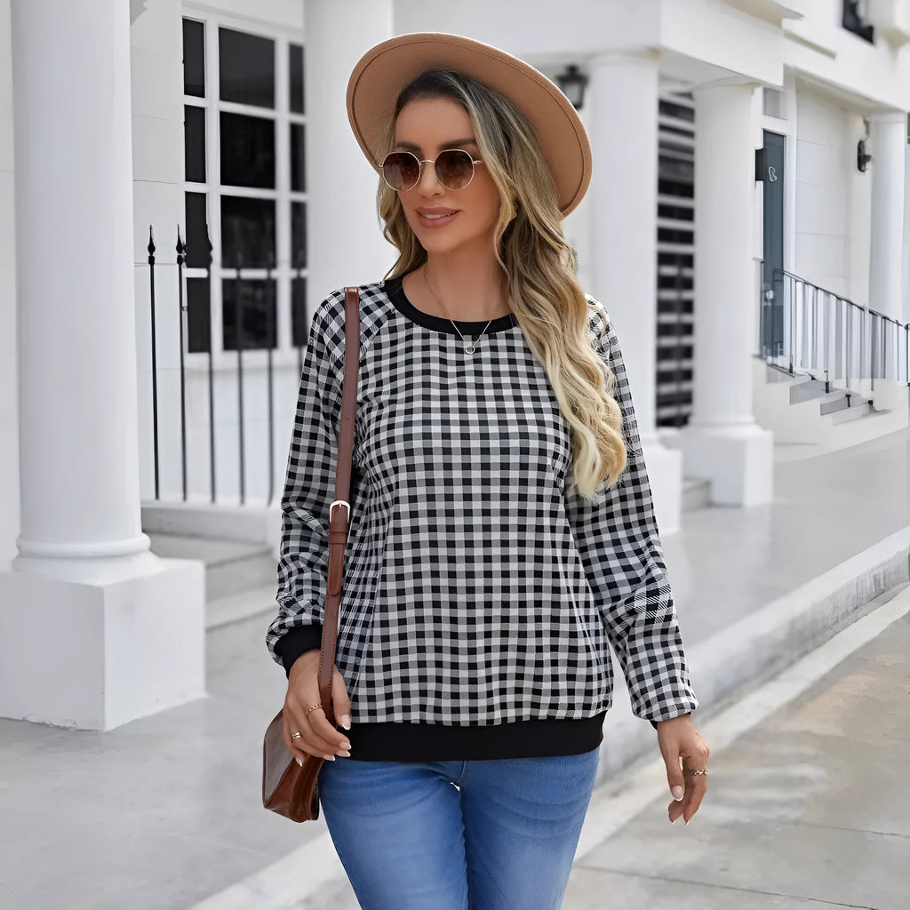 Black long sleeve polyester pullover sweater with a printed Japanese sweet plaid stripe pattern.