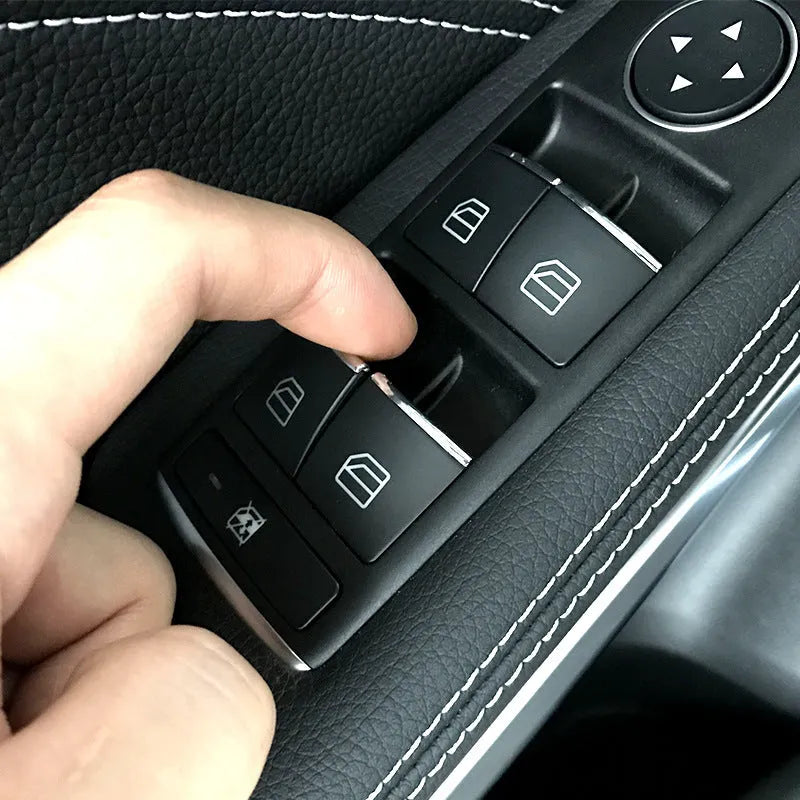Black ABS plastic self-adhesive decorative sticker for a car window lift button.