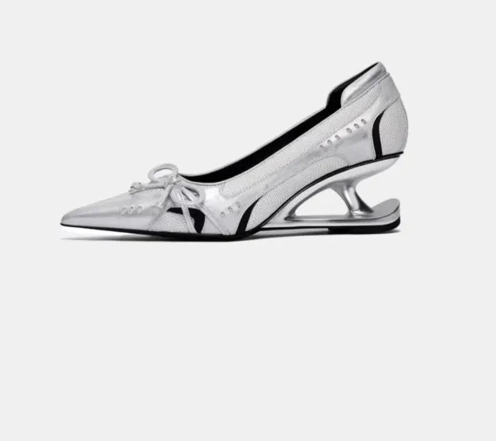Black women's pointed toe Mary Jane shoes with a unique floating shaped heel and slip-on design.