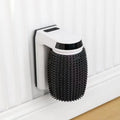 White automatic cat self groomer mounted in corner with silicone bristles for brushing
