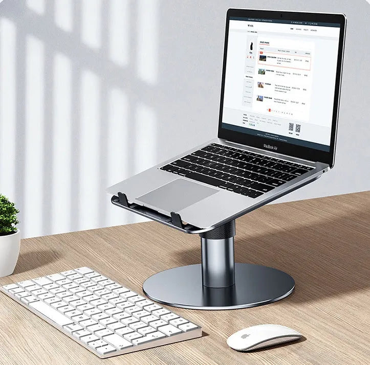 Silver adjustable aluminium laptop stand showing height adjustment and 360-degree rotating base.