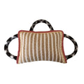 Jute dog tug toy with three rope handles in assorted colours on a neutral background.