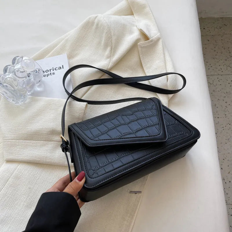 Women's square shoulder bag in PU leather with urban simplicity style showing horizontal shape