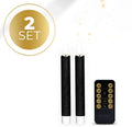 Four black plastic LED taper candles with a glowing 3D flame effect, standing upright.