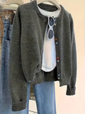 Dark grey women's polyester cardigan sweater with long sleeves and button front.