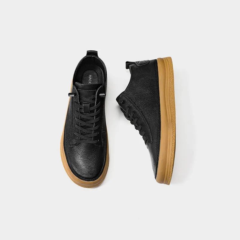 Men's black leather casual shoes with a round toe, flat heel, and lace-up closure on a rubber sole.
