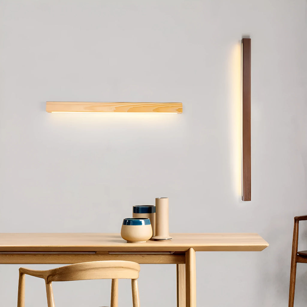 Modern wooden log strip wall lamp mounted on a wall in walnut colour