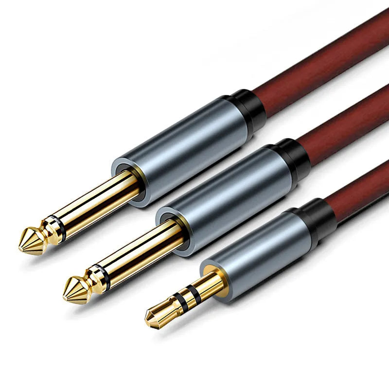 3.5mm to two 6.5mm male jack audio cable with black insulation and gold-plated plugs.