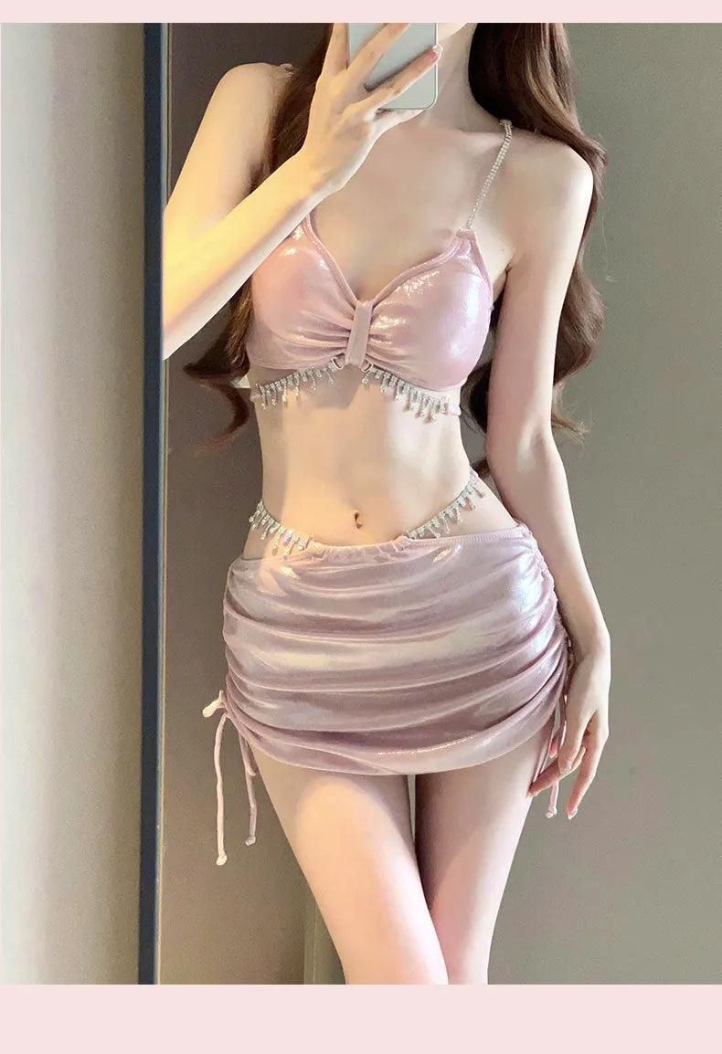 Women's solid colour polyester bikini swimsuit set in black or pink on mannequin