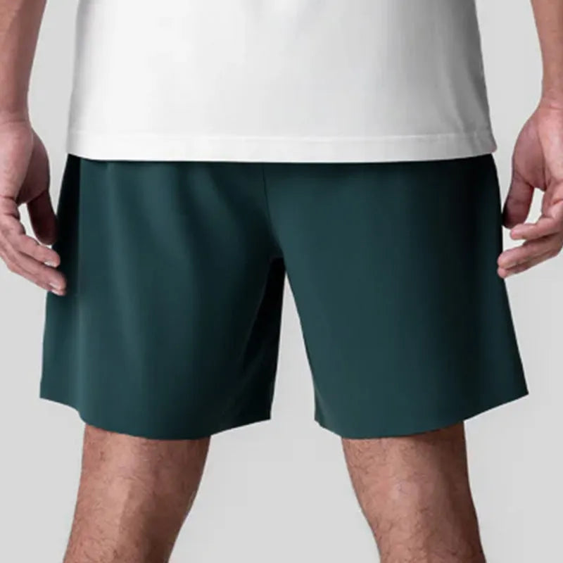 Men's grey seamless sports shorts with straight-leg knee-length design for athletic wear