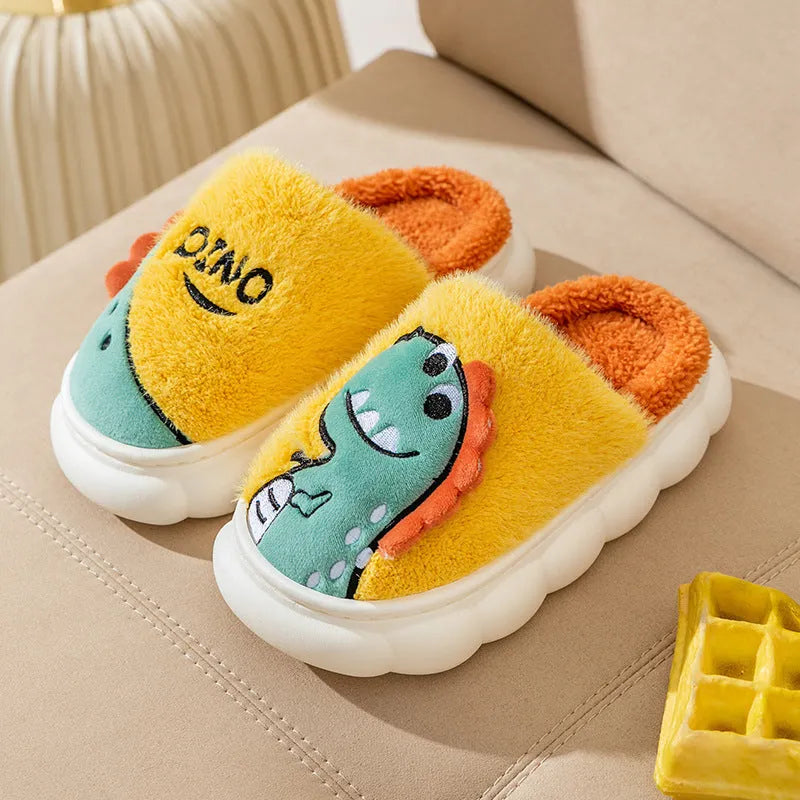 A pair of plush cotton couple slippers with dinosaur print in coffee, grey, or orange.