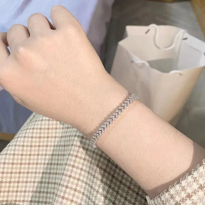 Silver plaid bracelet for women with moissanite stone on light background