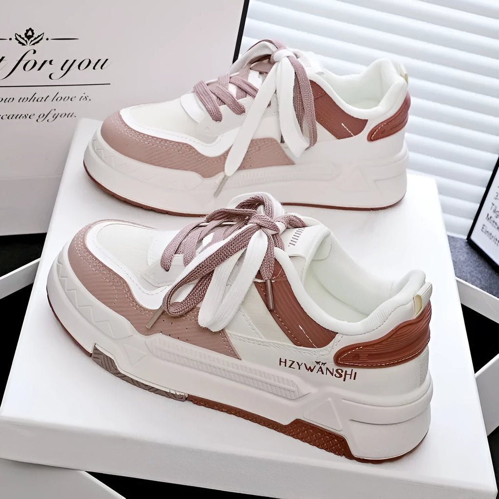 Minority board shoes in beige with thick rubber soles, cross shoulder straps, and front lace-up closure.