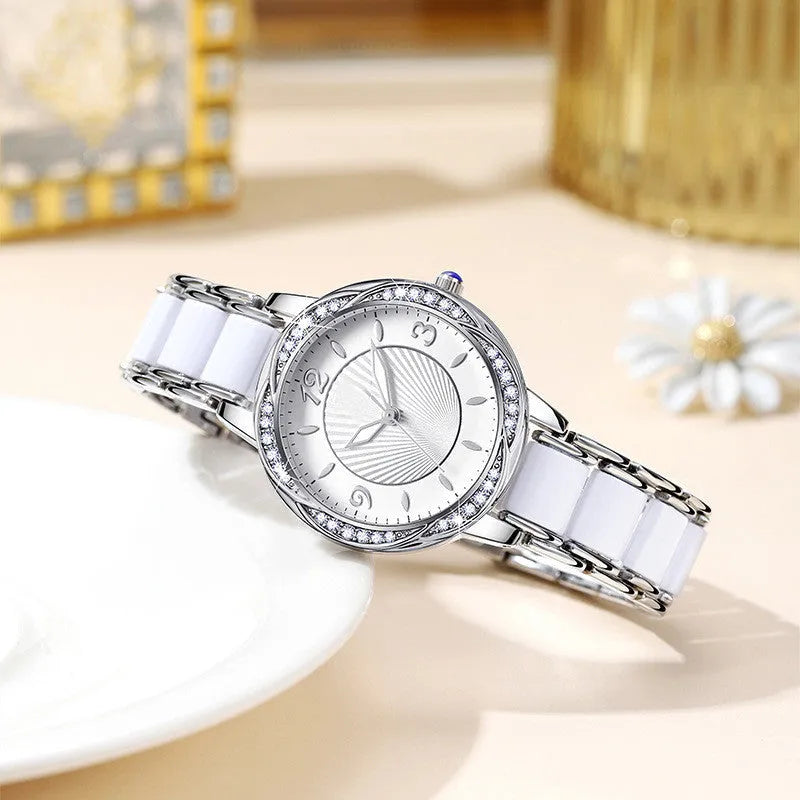 Women's quartz watch with ceramic-style steel strap, alloy case, and 31.1mm white dial in rose gold