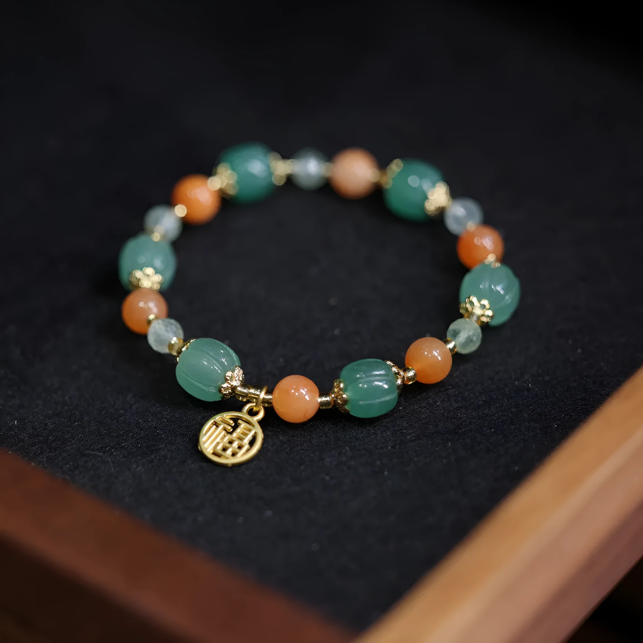 Traditional Chinese Duobao pumpkin bracelet with Jinsi Jade barrel beads and Fuka hanging charm