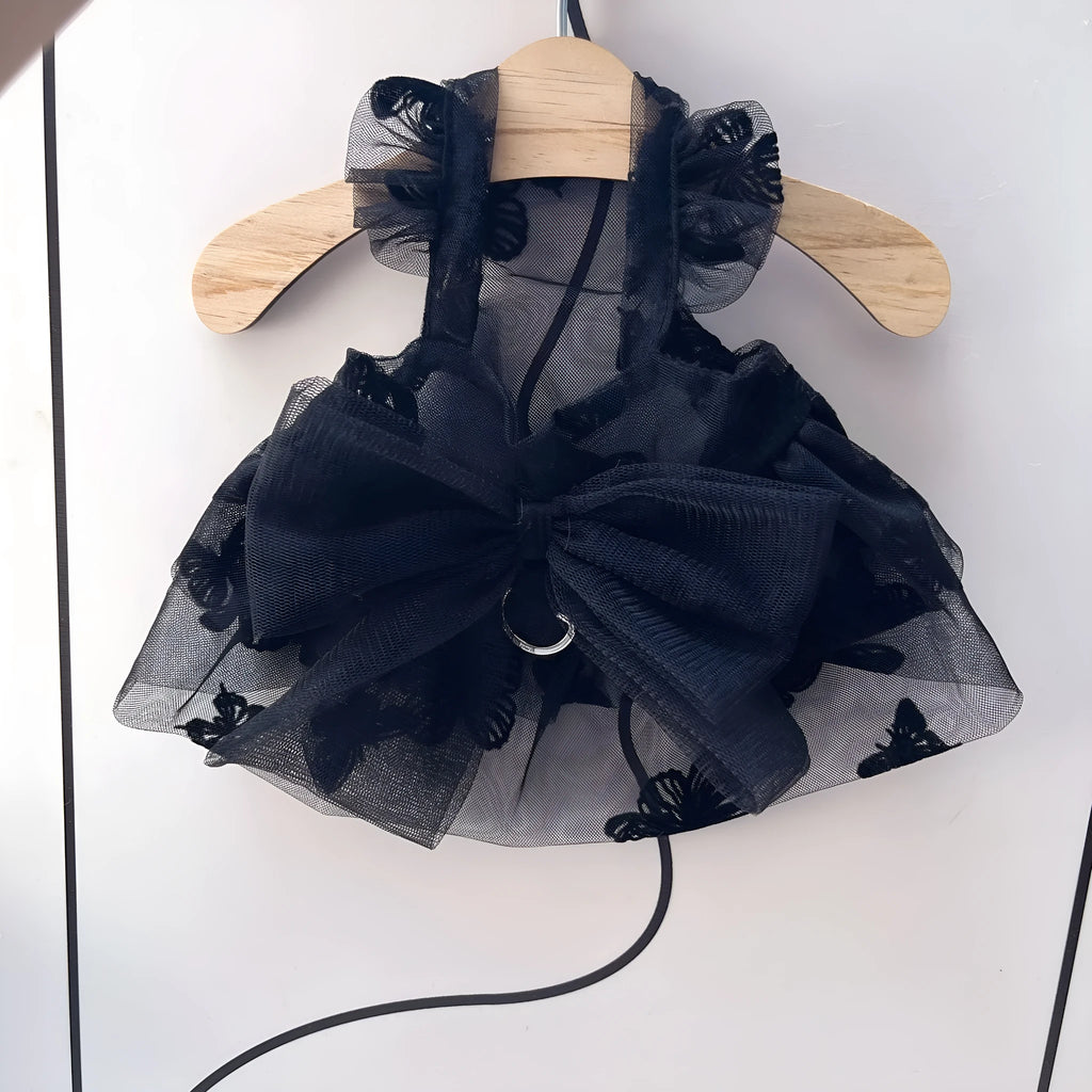 Black layered tulle princess skirt on a small dog, showing elastic waistband and tiered design.