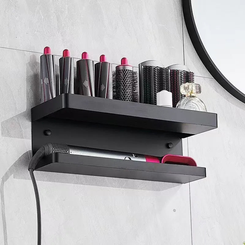 White double-layer aluminium bathroom storage rack mounted on a wall holding hair curlers.