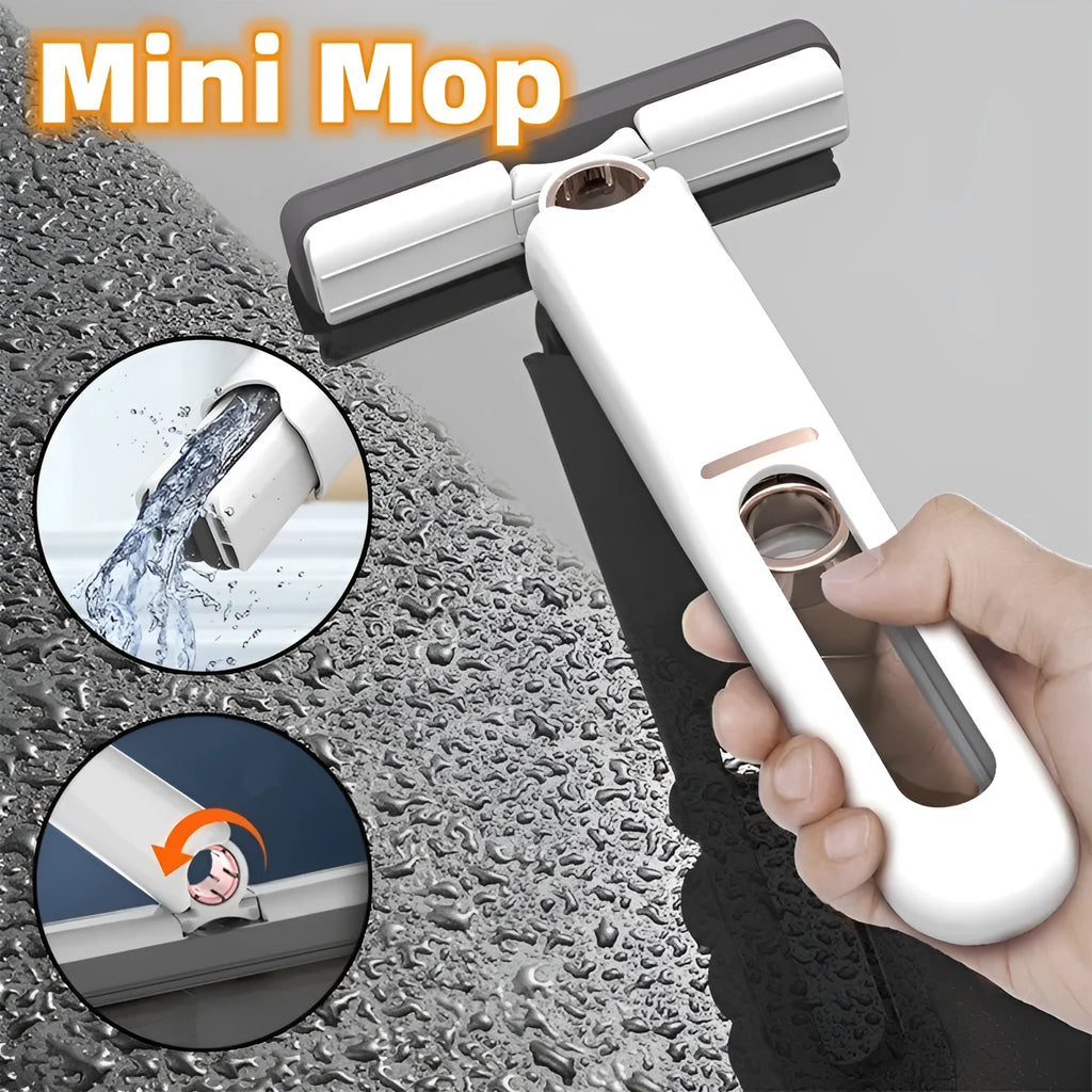 Mini plastic squeeze mop with a blue biodegradable cotton head and a push-pull dehydration ring on the handle.