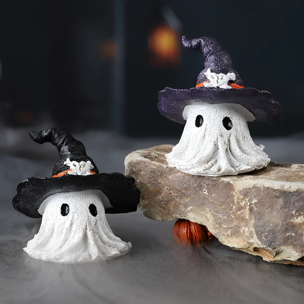 Purple and black resin wizard hat and ghost holiday ornaments.