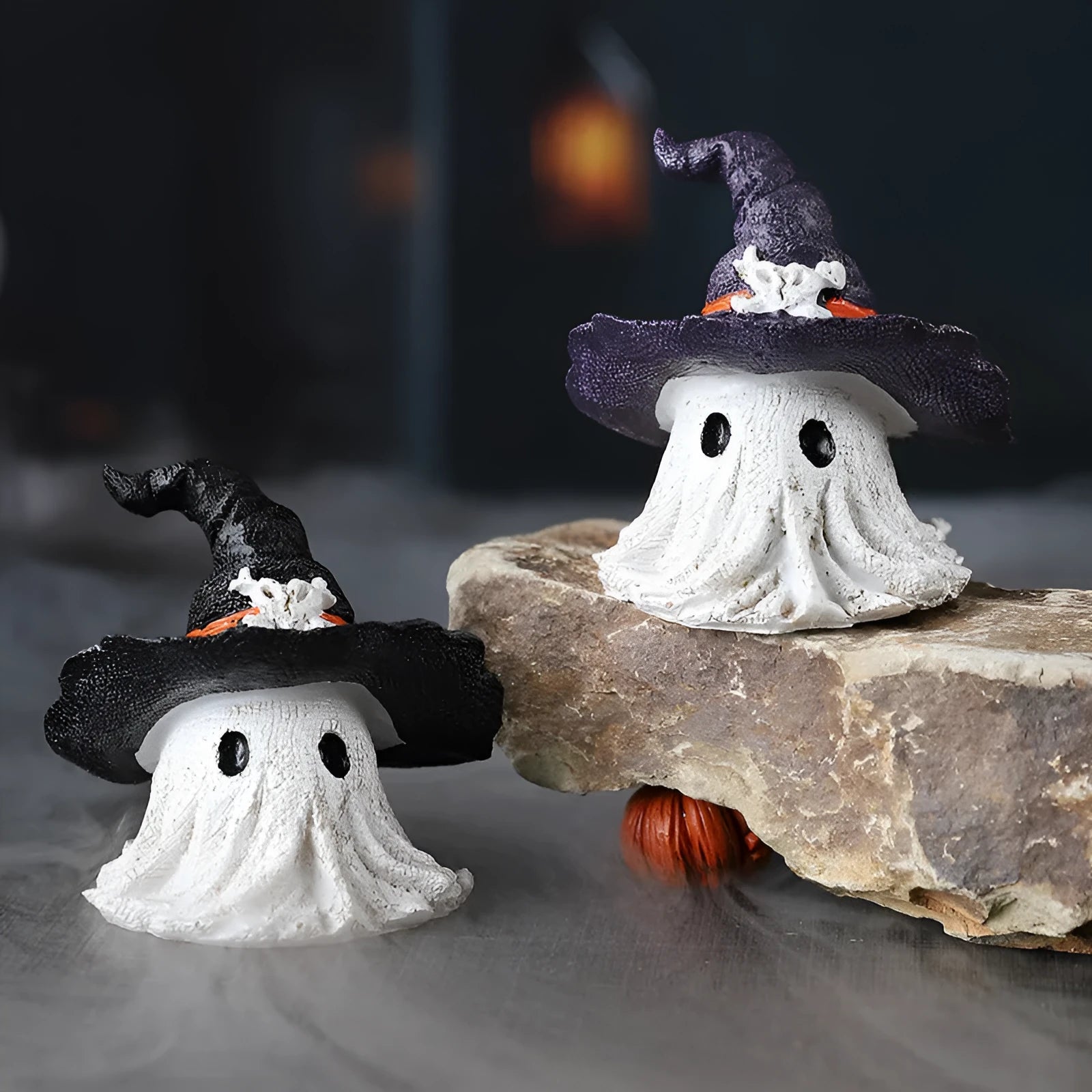 Purple and black resin wizard hat and ghost holiday ornaments.