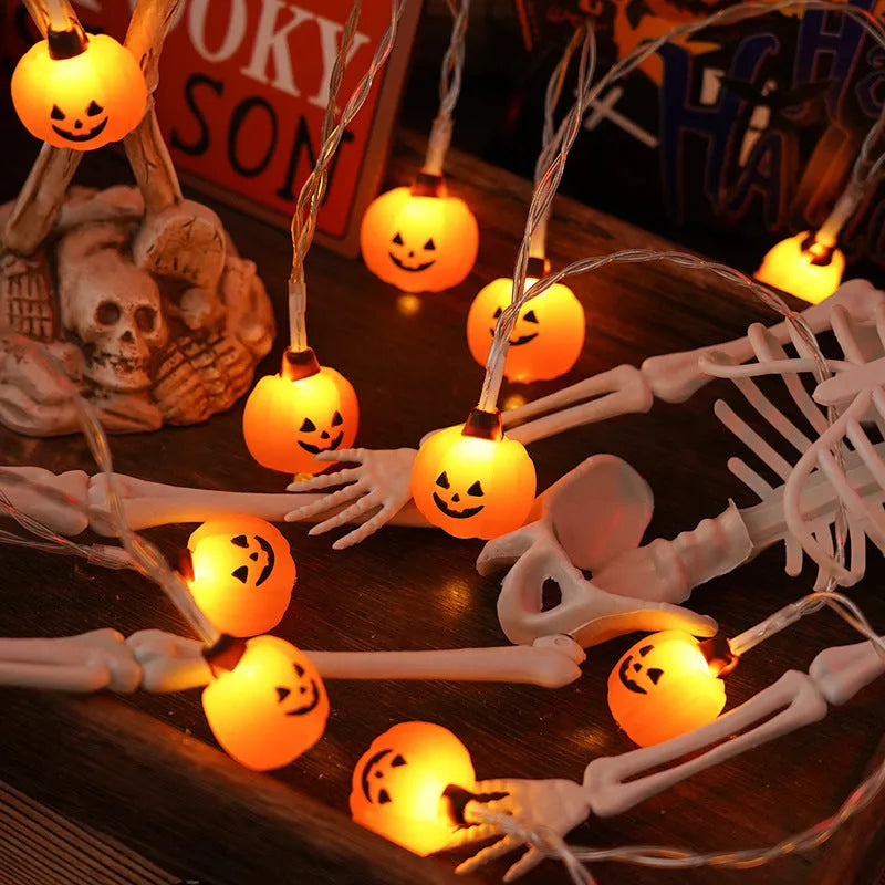 PVC Halloween lighting chain with pumpkin, ghost and bat shapes in warm white LED glow