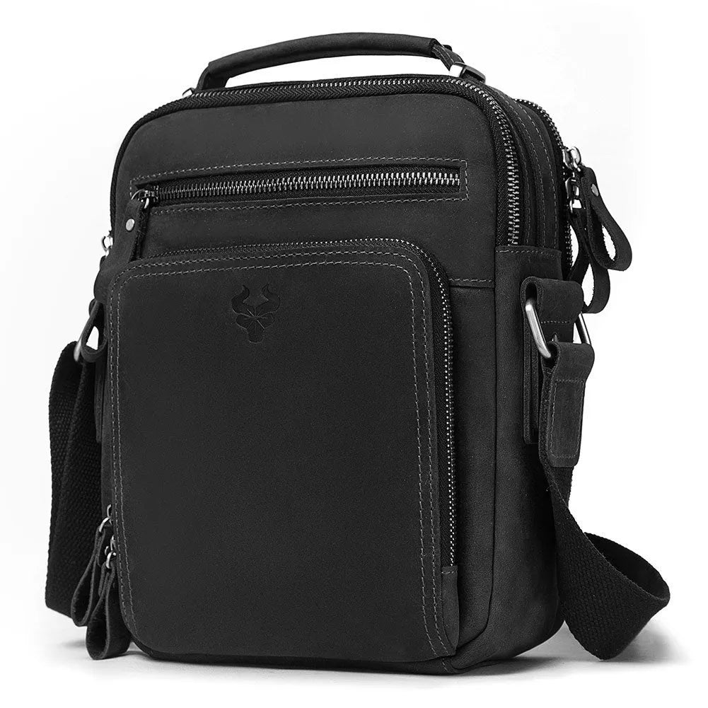Men's brown Crazy Horse leather crossbody bag with sewing line detail on a table.