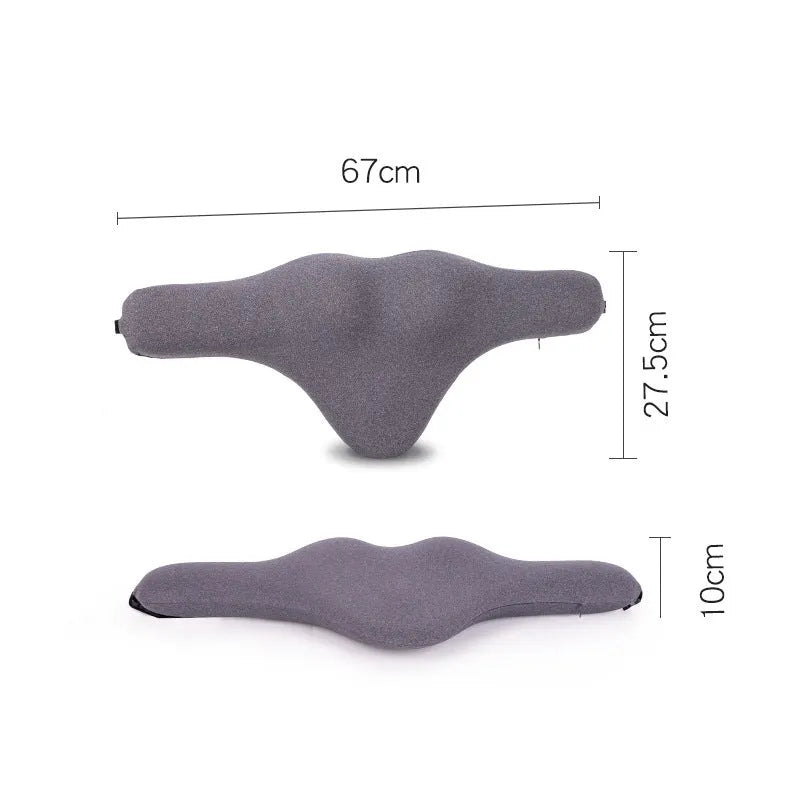 Dark grey memory foam car neck pillow resting on a car seat headrest.