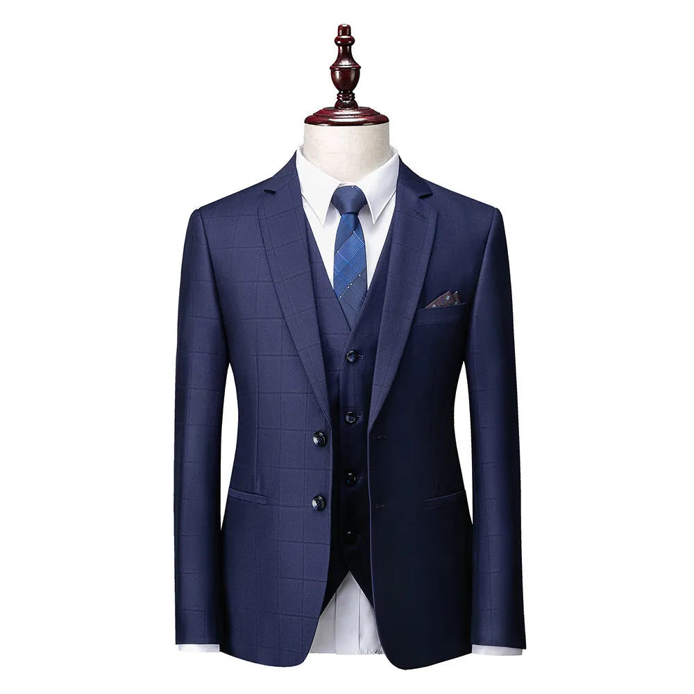 Men's navy blue slim fit three-piece suit with jacket, vest, and trousers on hanger