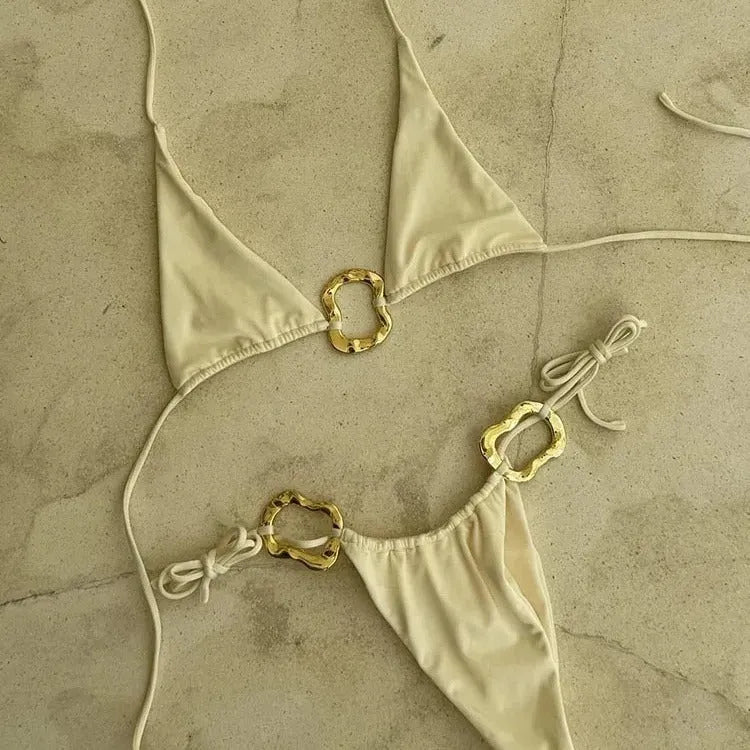 Women's halter neck bikini set with lace-up front detail and low waist briefs in a solid colour.