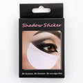 Pack of disposable half-moon shaped eyeshadow shields on a pink background