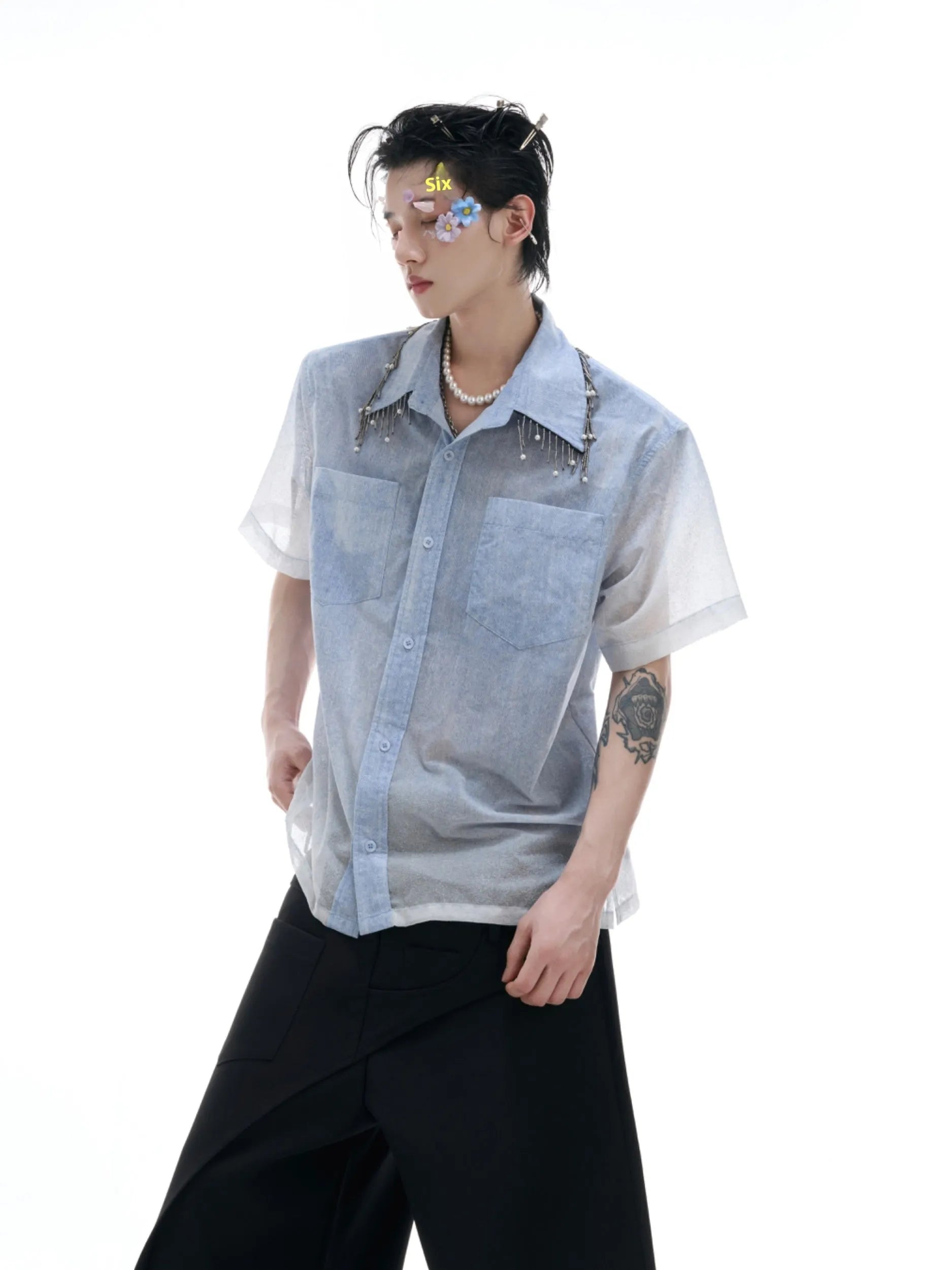 Blue and white gradient loose short shirt with half sleeves on a hanger.