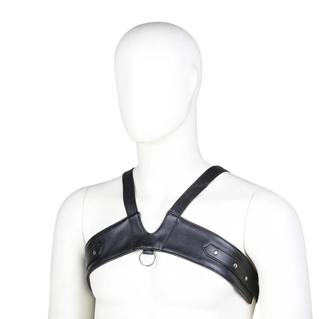 Black leather adjustable men's chest strap harness laid flat on a neutral background with adjustable fastener visible