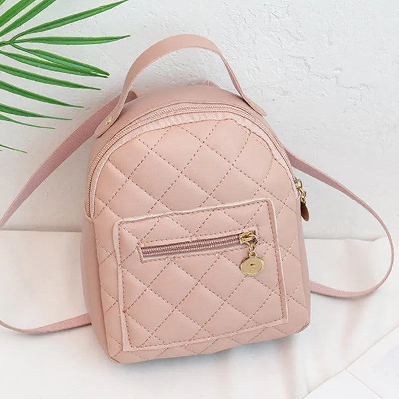 Hard square girls backpack with embroidered floral design in pink colour.