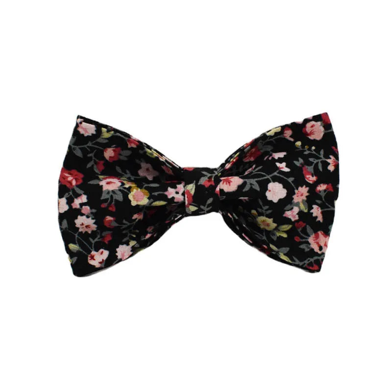 Four-piece pet accessory set with dog collar, leash, removable bow, and printed vest in cloth material