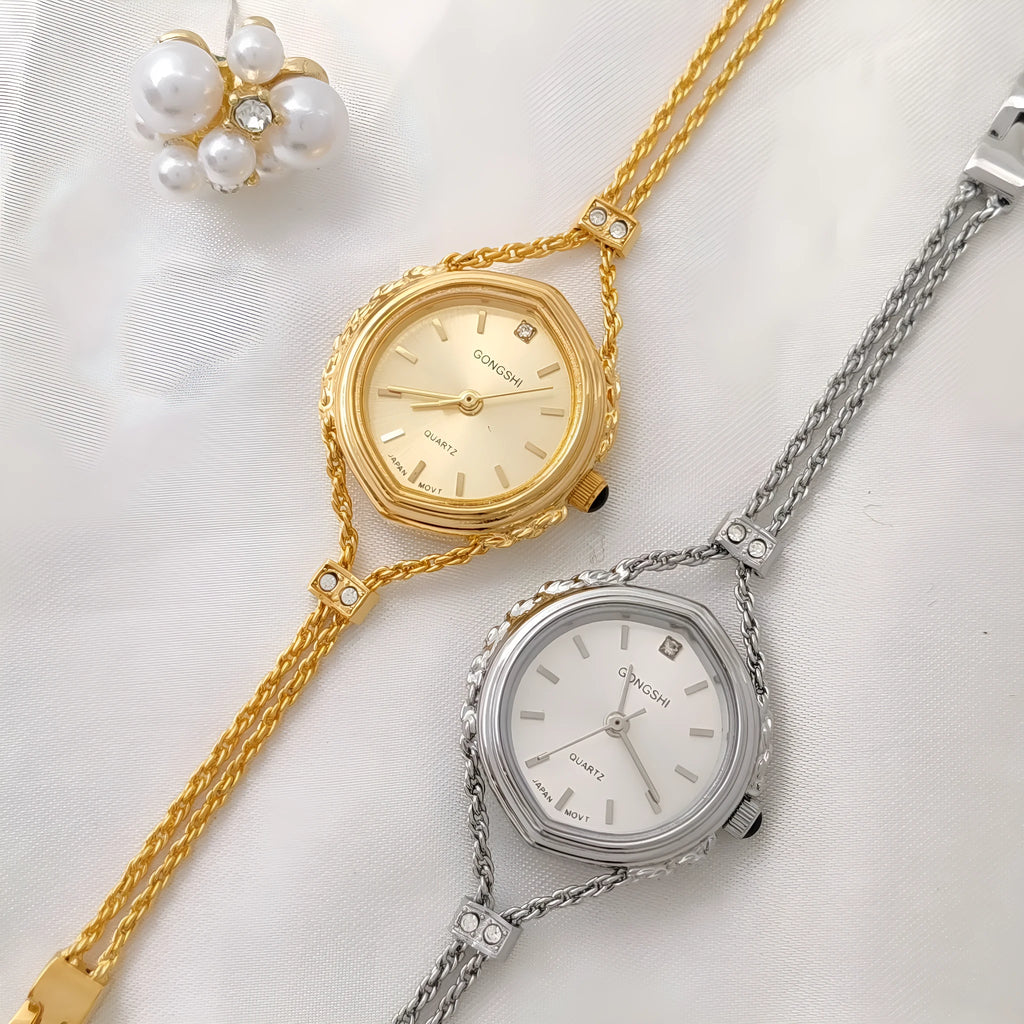 Ladies Mori-style quartz watch with 25mm dial on a metal chain strap in gold colour.