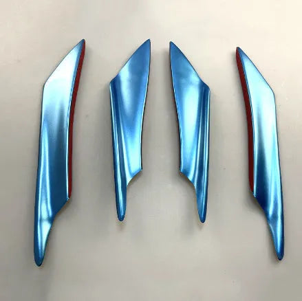 Set of four carbon fibre effect ABS plastic bumper spoiler blades for car modification.